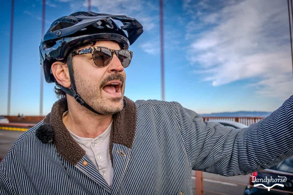 Bike tour guide sharing the history of a significant landmark in San Francisco