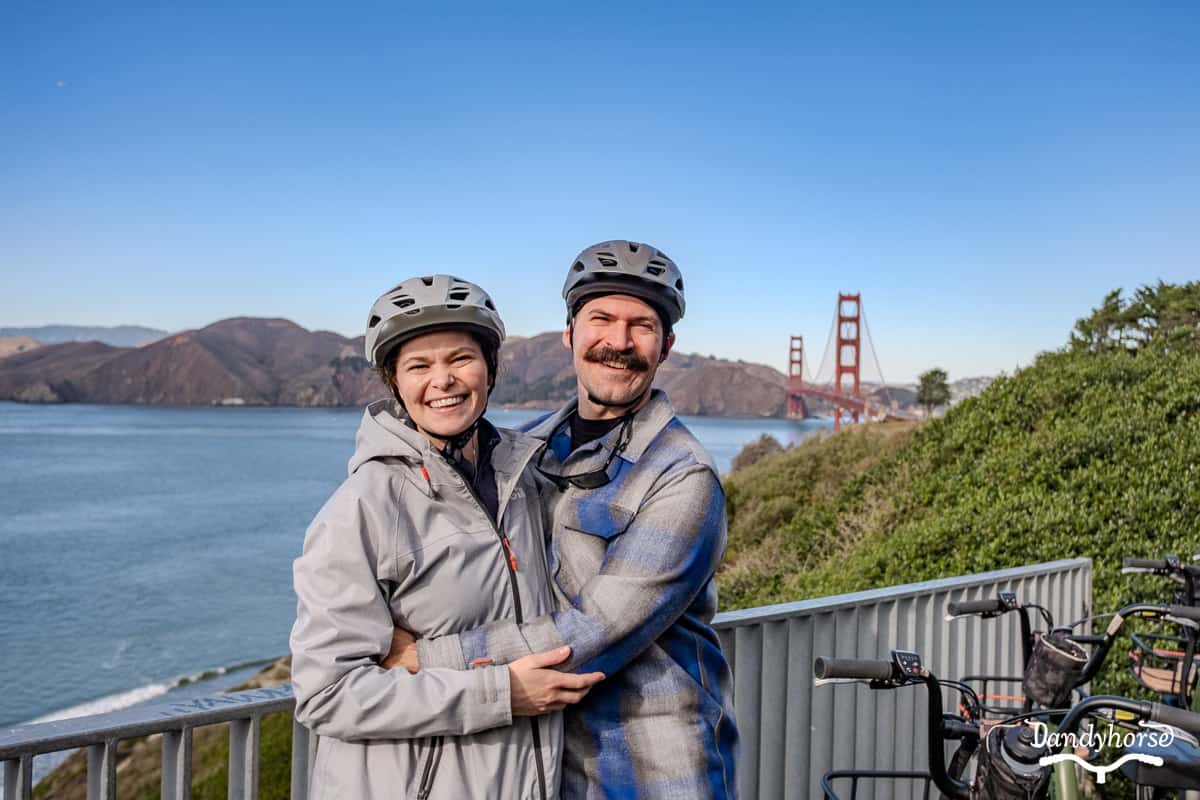 Couple with electric bikes at a Golden Gate Bridge overlook