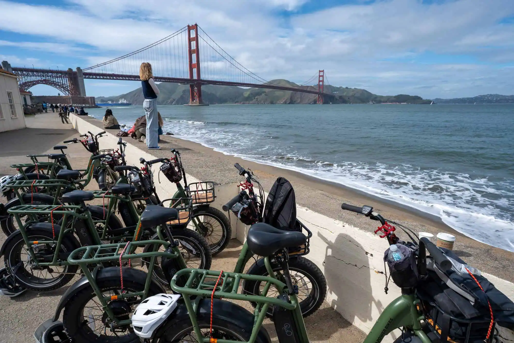 The Golden Hour — Golden Gate Bridge E-Bike Tour 1 Electric bikes at crissy field beach with golden gate bridge at sunset san francisco