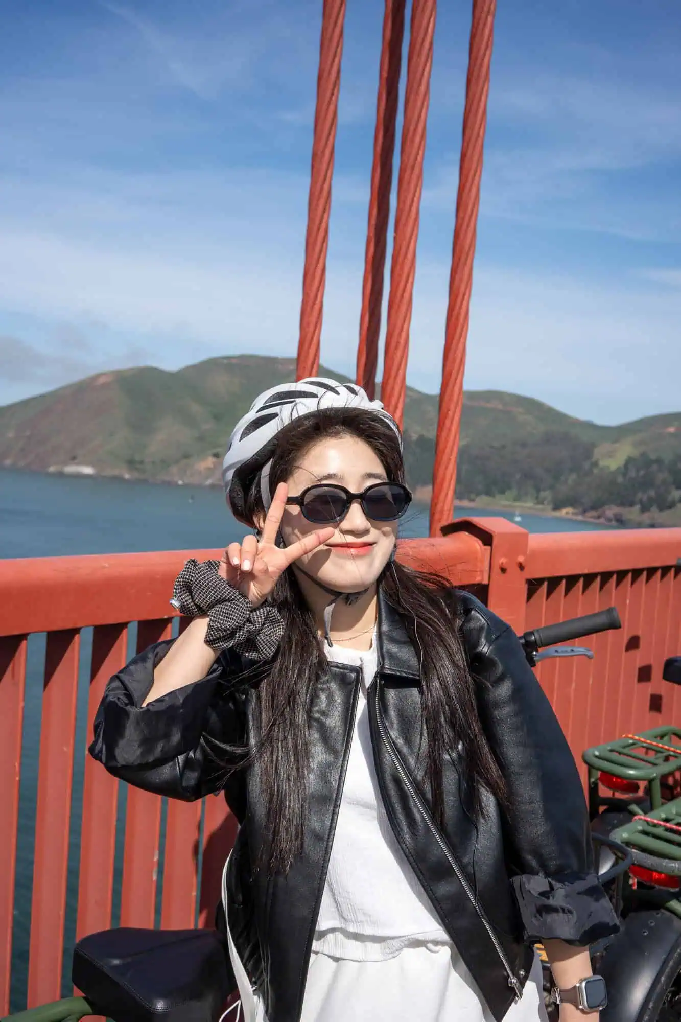 The Ultimate Electric Sf Bike Tour 19 Happy cyclist posing at golden gate bridge on san francisco e-bike tour experience